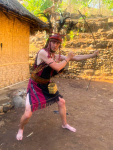 Me, wearing traditional tribal costume, with a bow and arrows.
