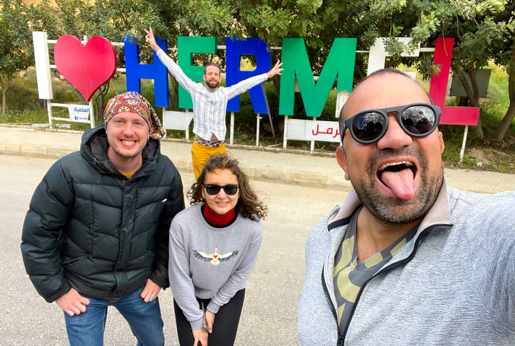 The four of us standing in front the of I Love Hermel sign