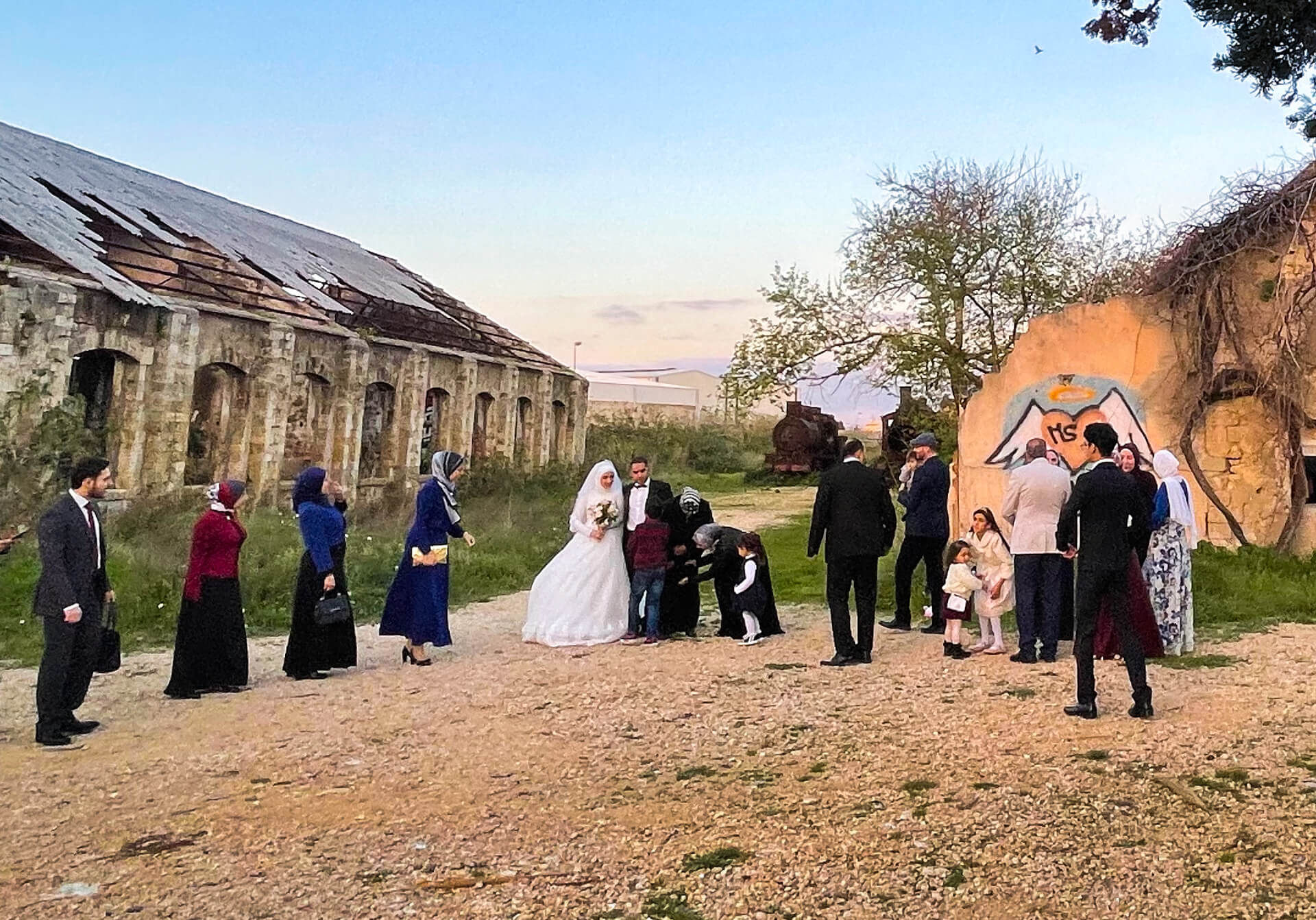 A wedding party taking photos in the old station