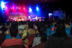 Musicians on stage during a Bihu festival performance.