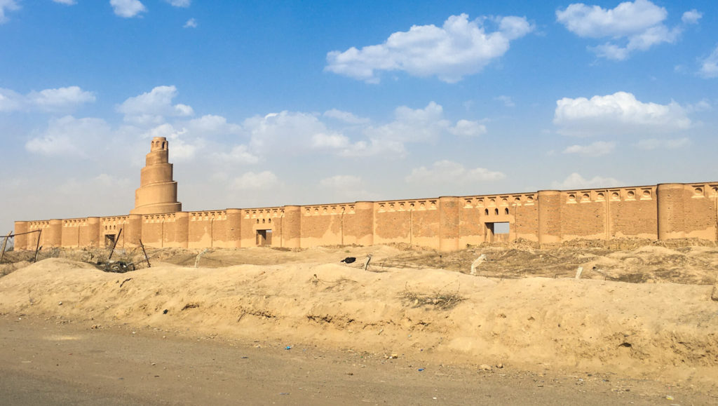 The Malwiya Minaret rises above the wall of the open-air mosque.  