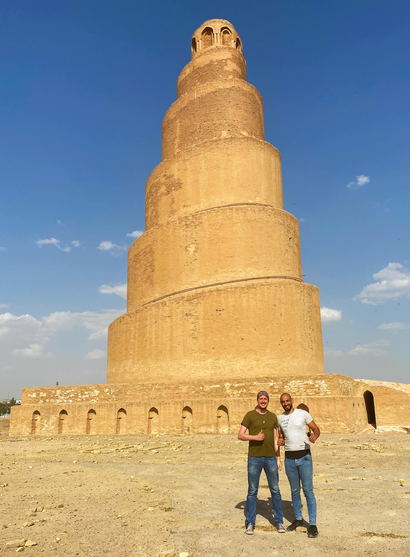 My friend Zeid and I standing in front of the minaret of the Malwiya mosque.