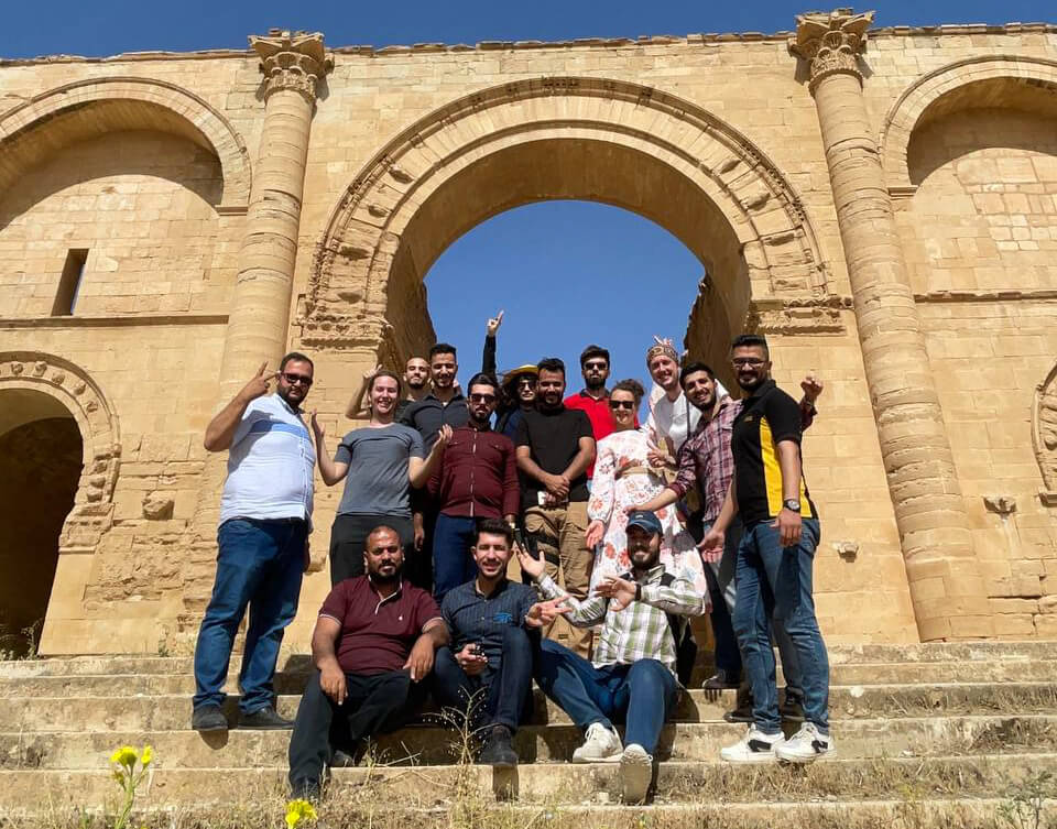 Me, Anna and our new friends in front of the main arch of Hatra.