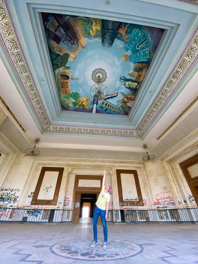 Me, standing in the centre of a room, pointing at the beautiful painted ceiling. 