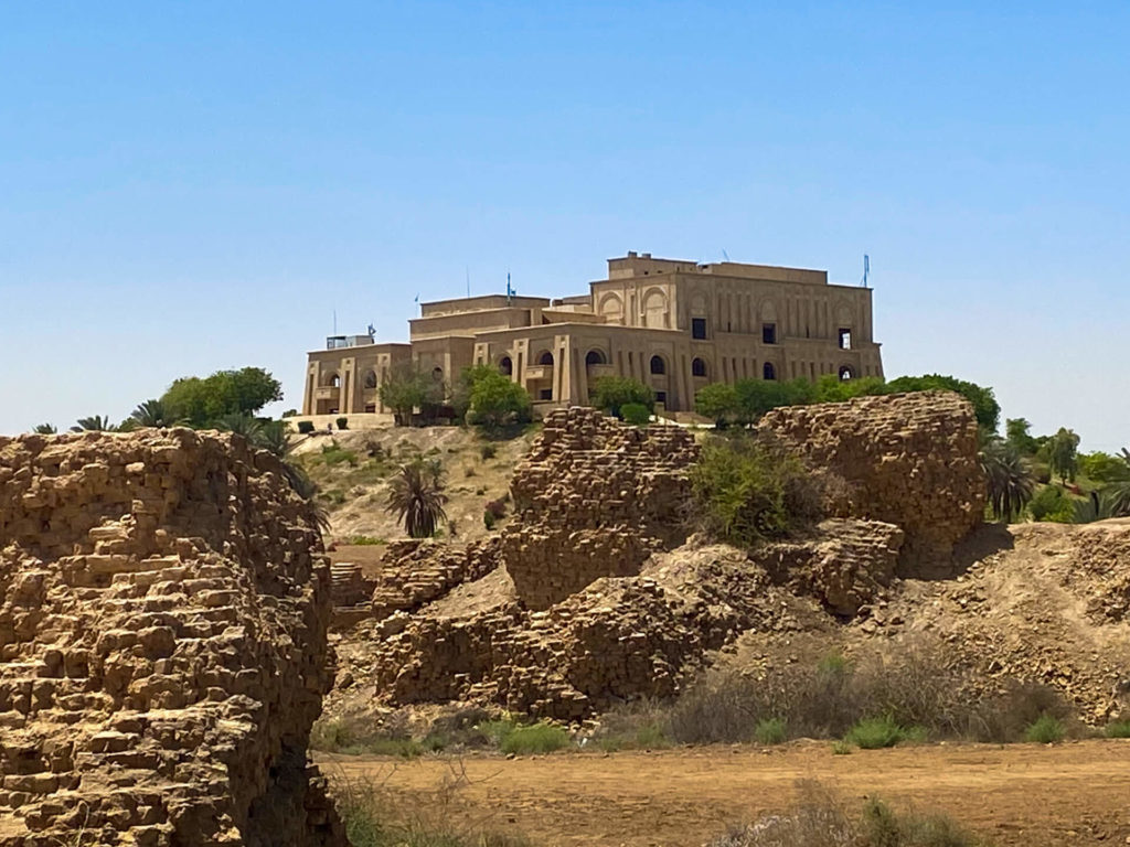 Saddam Hussain's summer palace sitting on a hilltop, viewed from the ruins of Babylon.