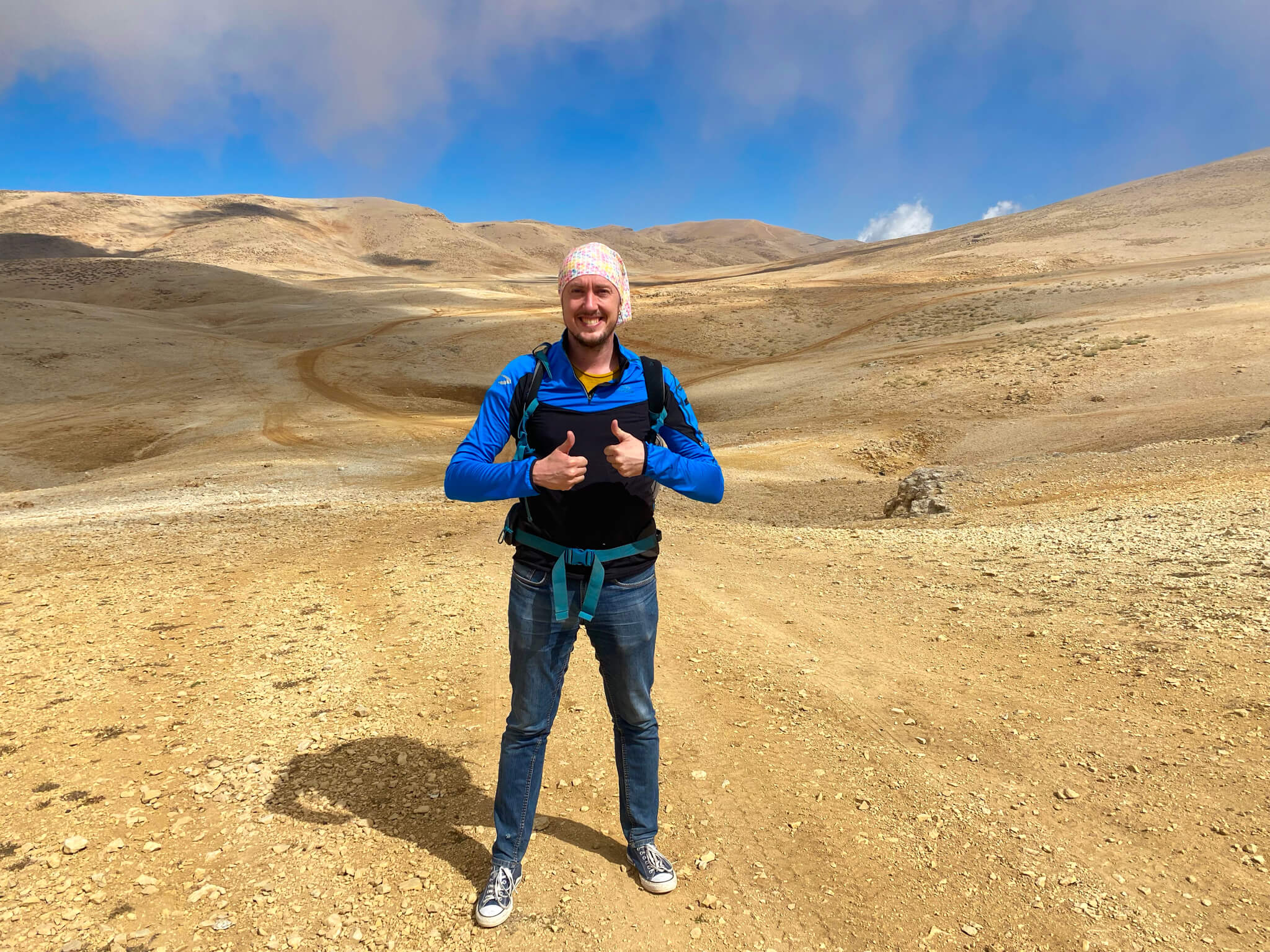 Me, standing on a barren landscape of brown dirt