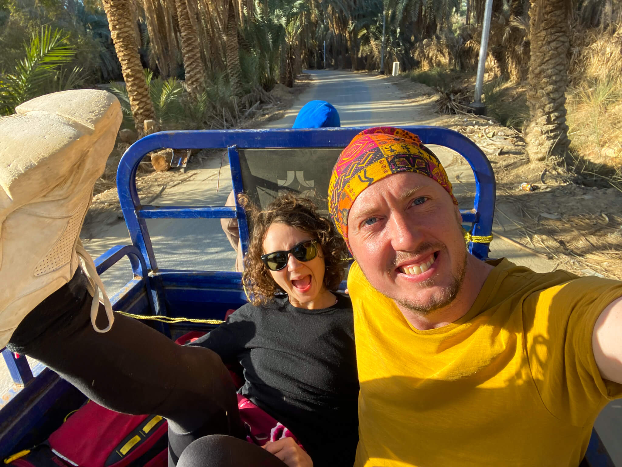 Me and Anna sitting in the back of a motorized tricycle cart.