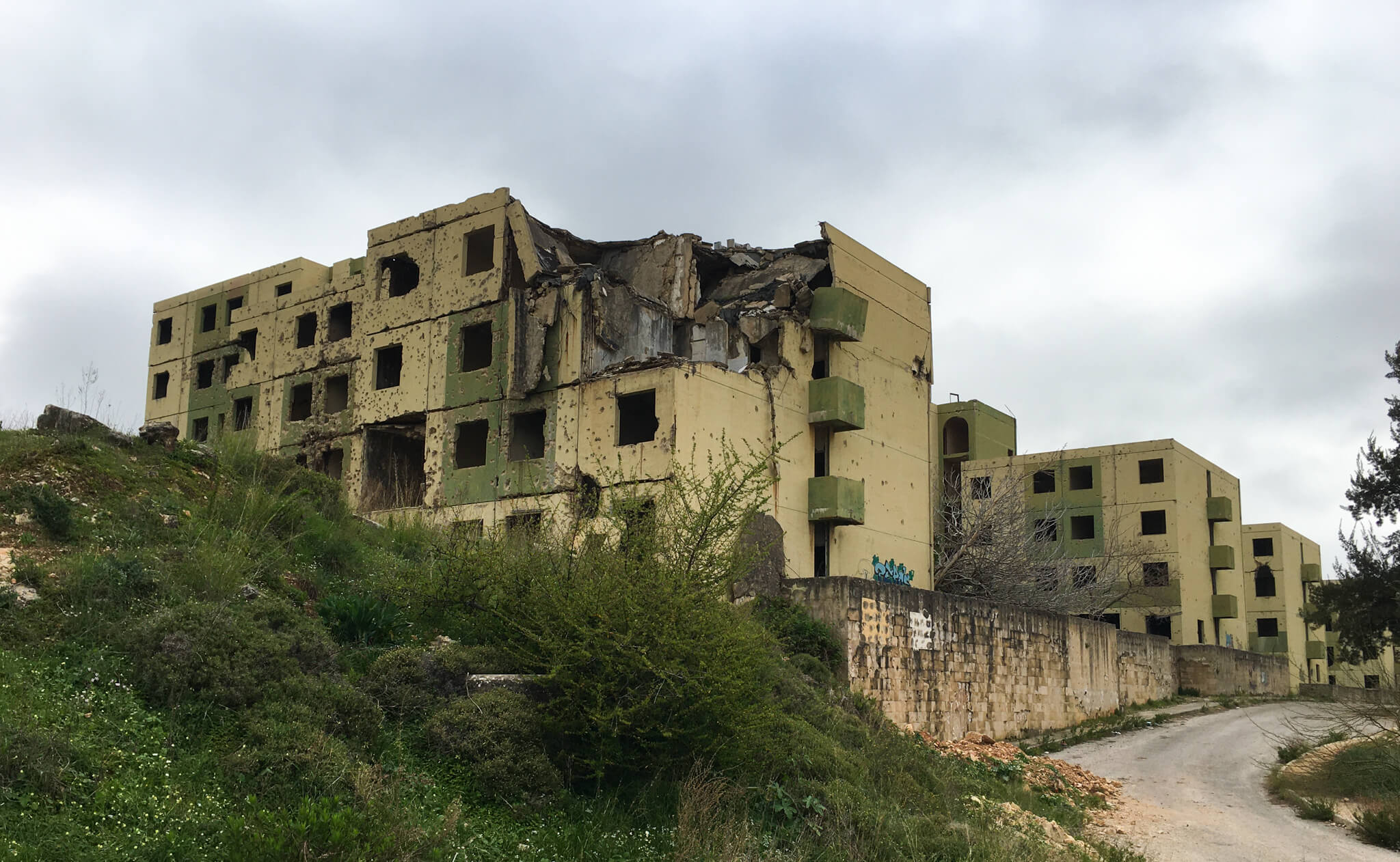 A possible residential building with the top corner blown off in an explosion.