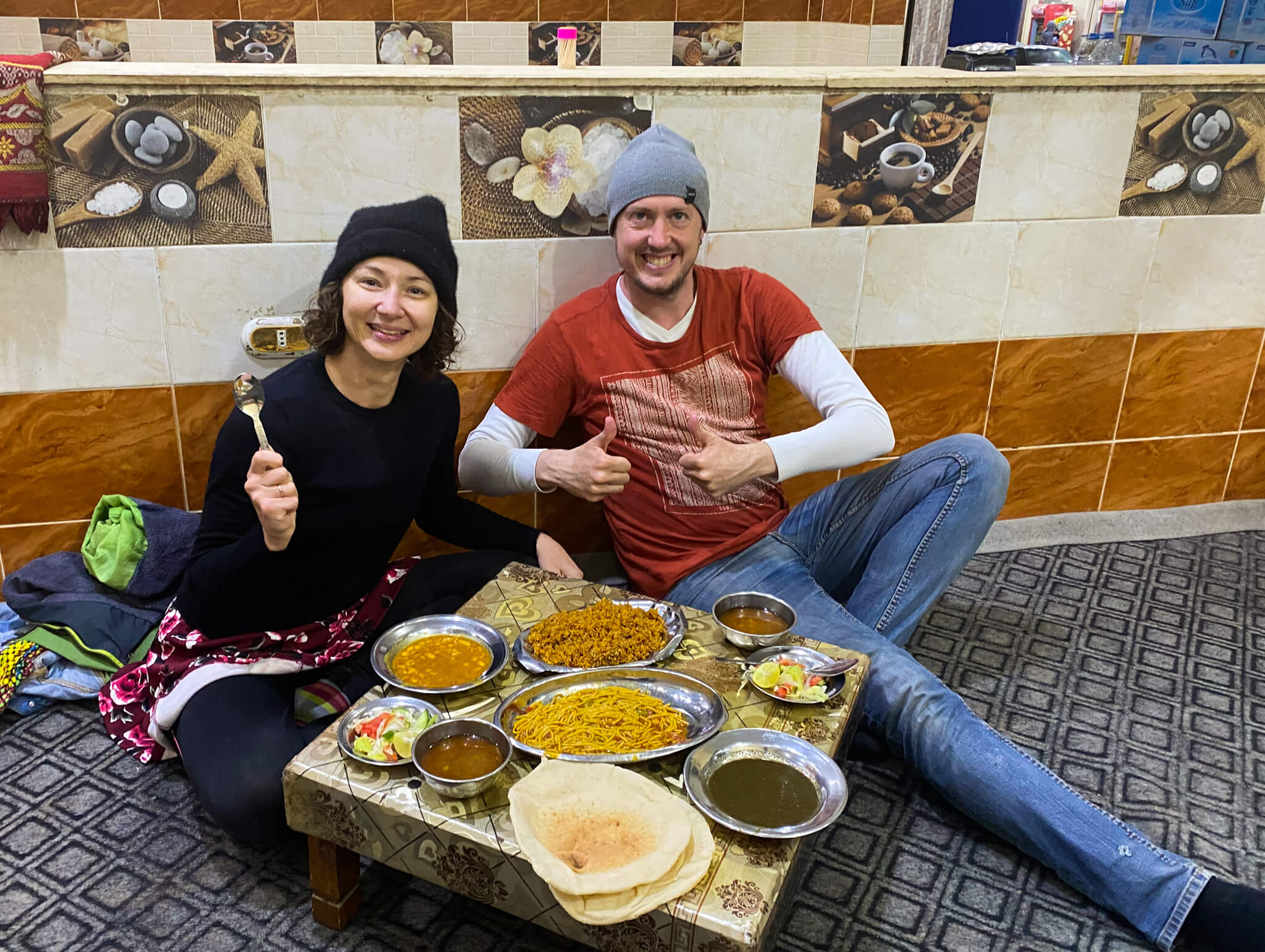 Me and Anna eating local Egyptian food while sitting on the floor.