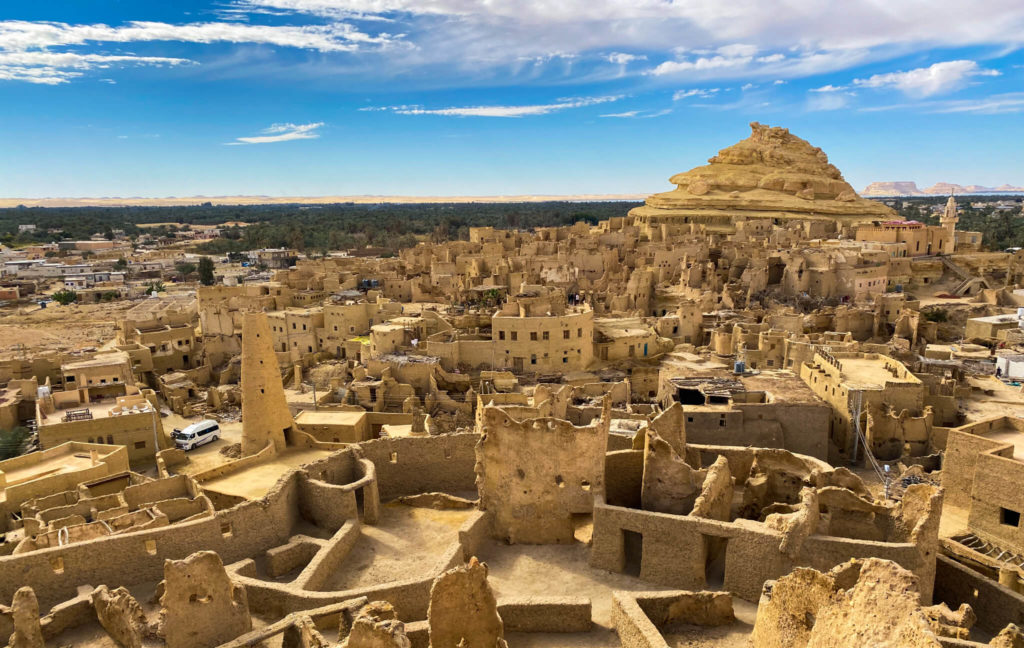 The view over Siwa old town with the mud minaret and mountain from the top of the Shali Fortress