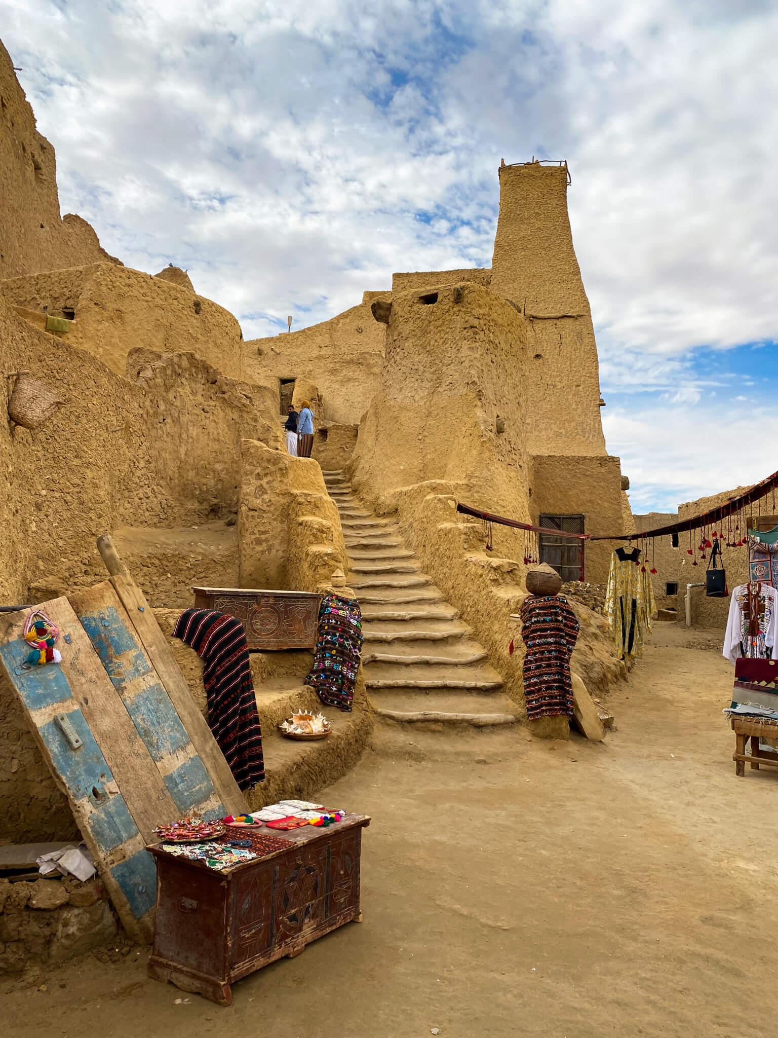 Mud staircase with craft stands on either side.