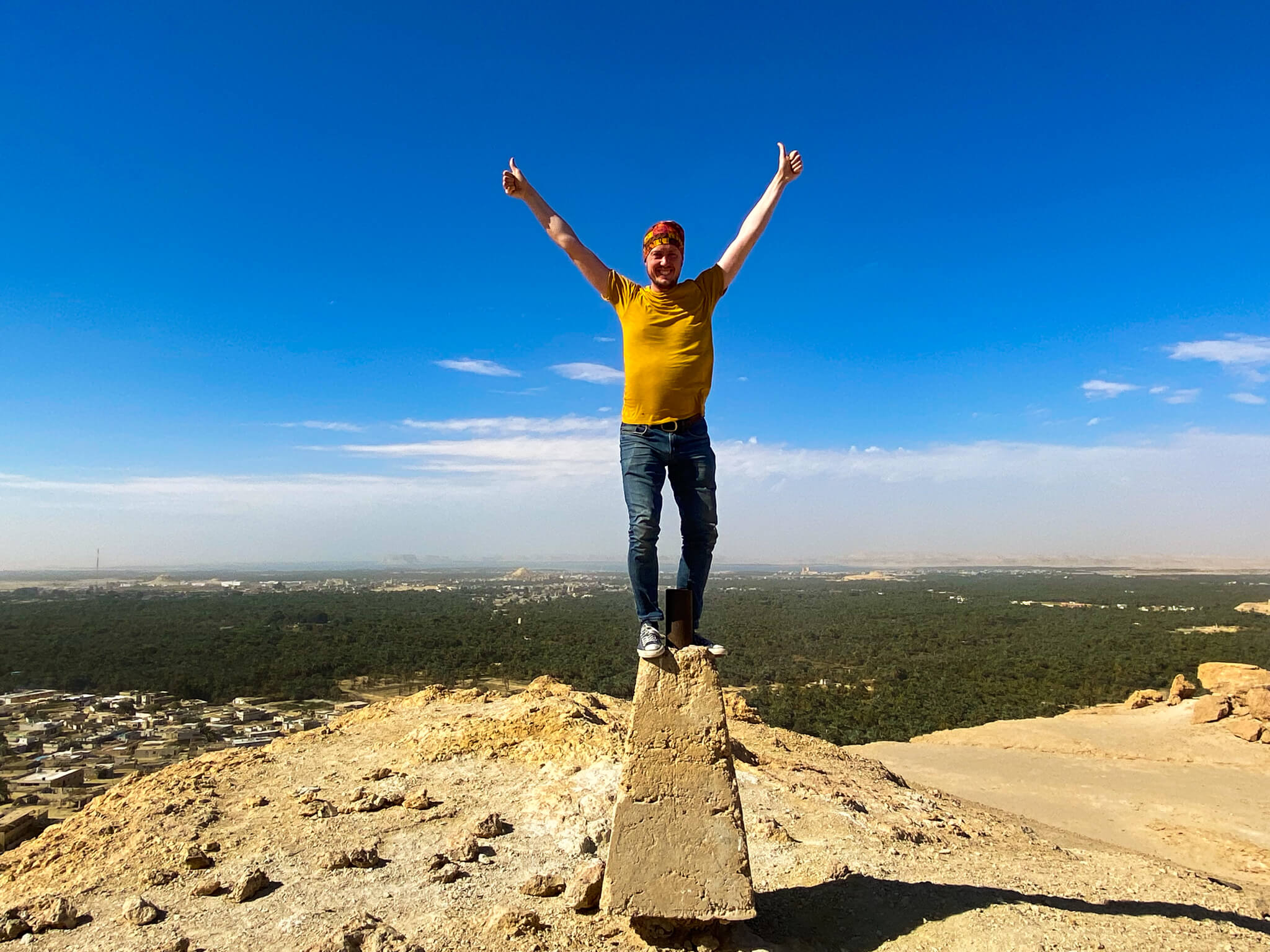 Me standing on top of the summit marker on Dakrur Mountain.