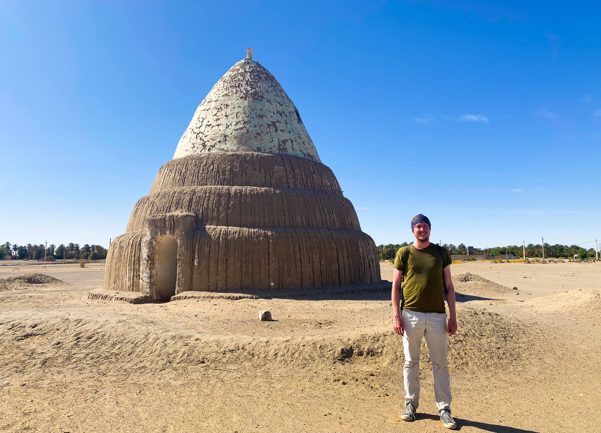 Me, standing in front of a conical Meroitic tomb in a Kerma.