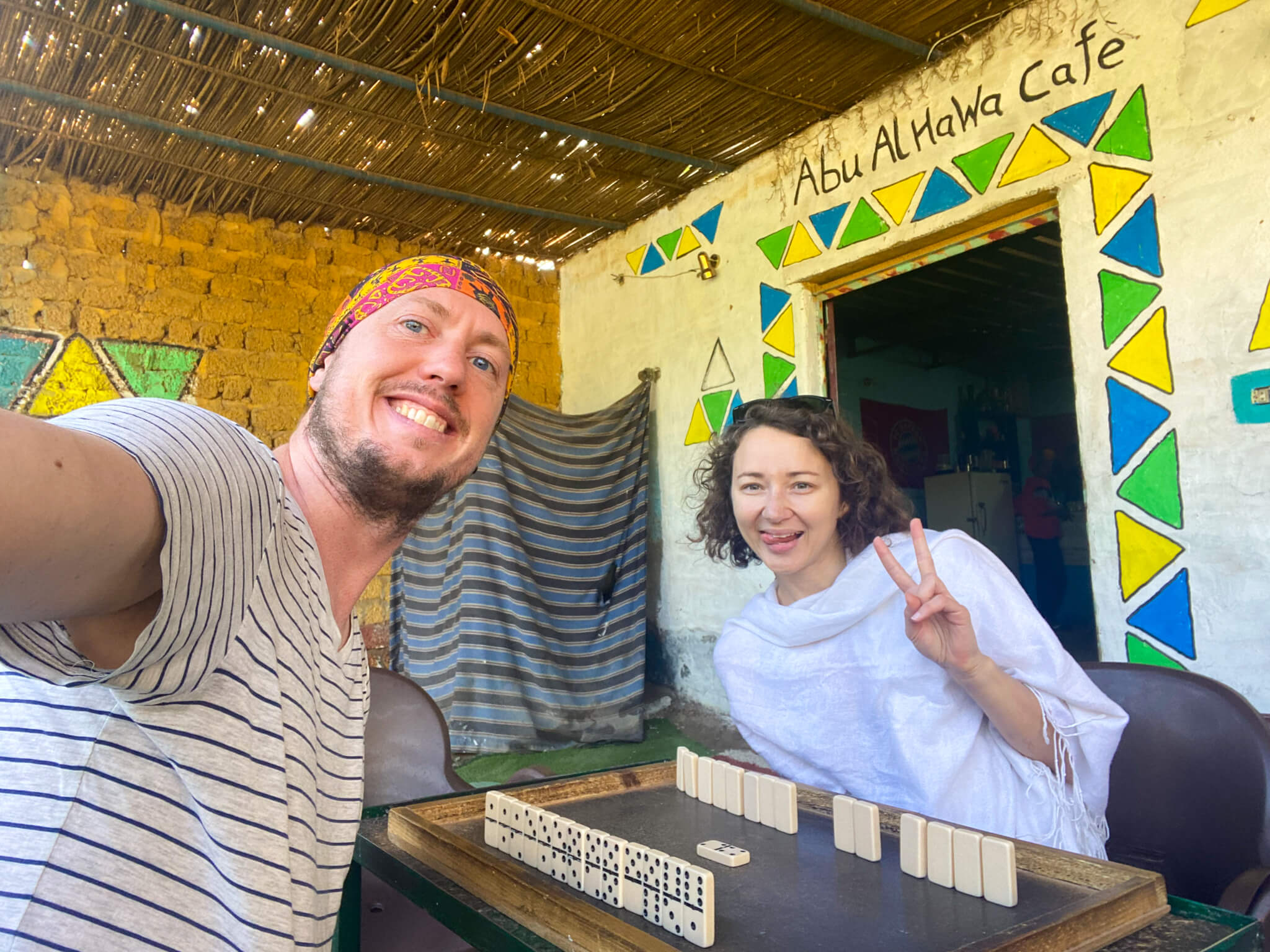 Anna and I playing dominoes in a cafe.