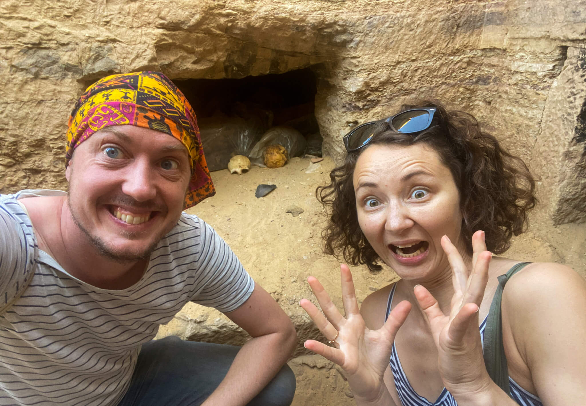 Anna and I in the desert looking shocked at two two human skulls we found.
