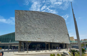 A huge stone facade of the modern Library of Alexandria.