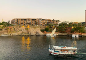 The Old Cataract Hotel standing impressively on a rock overlooking the River Nile.