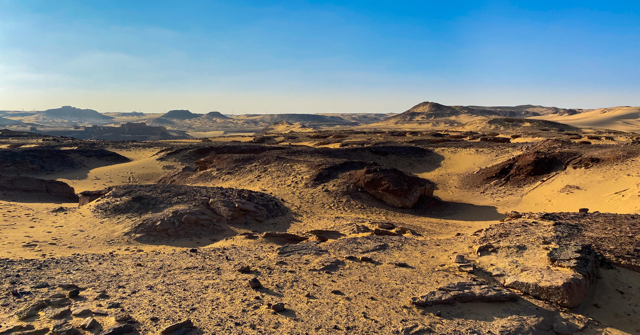 The Sahara desert with the Monastery of St. Simeon in the distance.