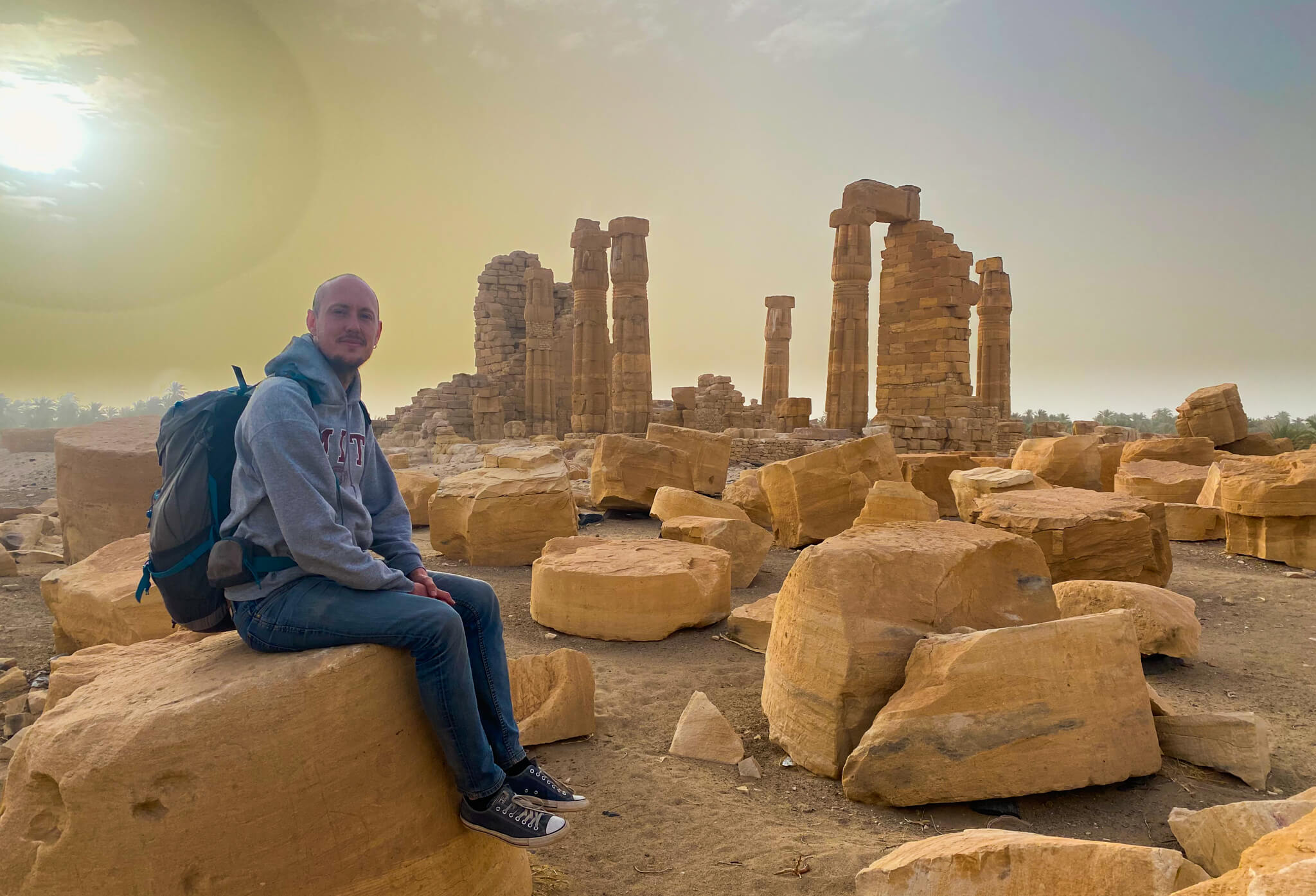 Me, sitting in front of the ruins of the Temple of Soleb at dawn