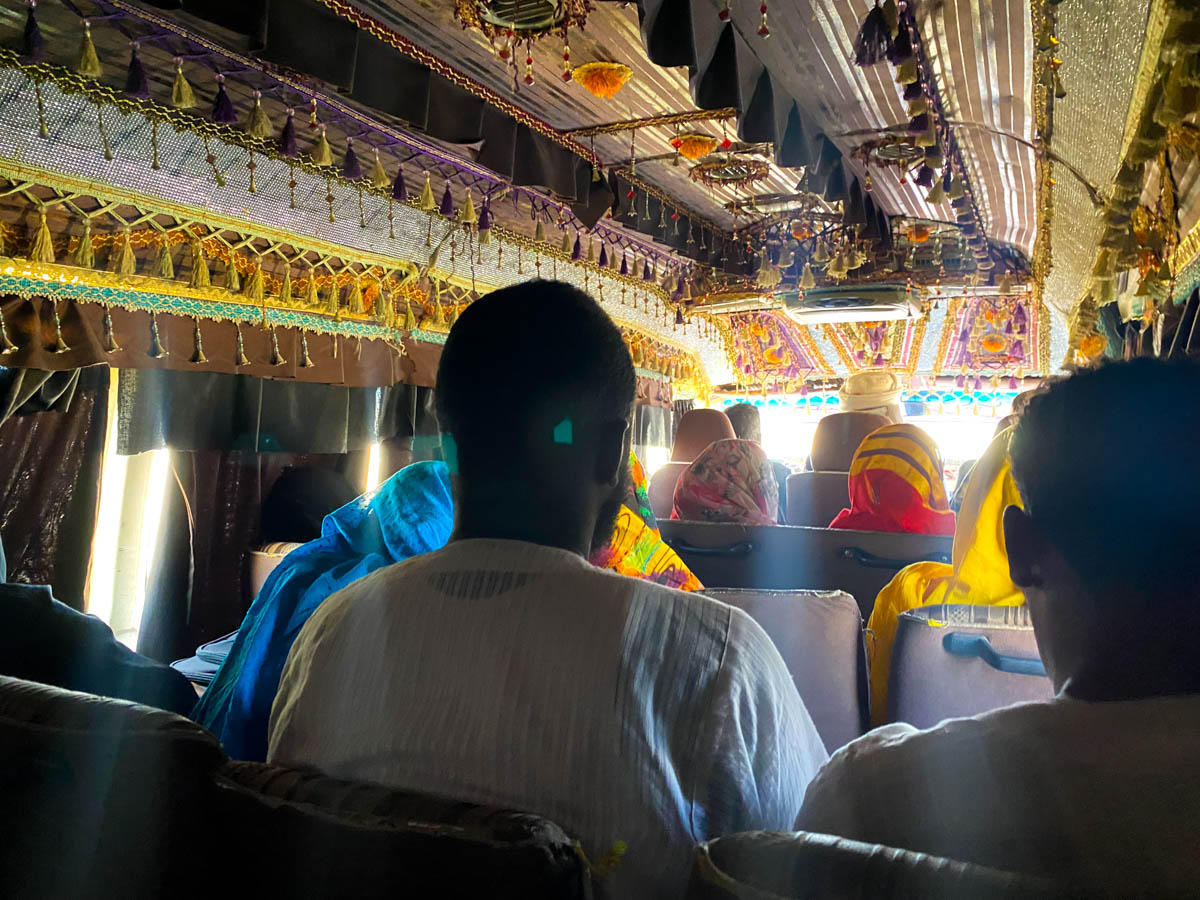 The inside of the minibus and its brightly decorated roof.