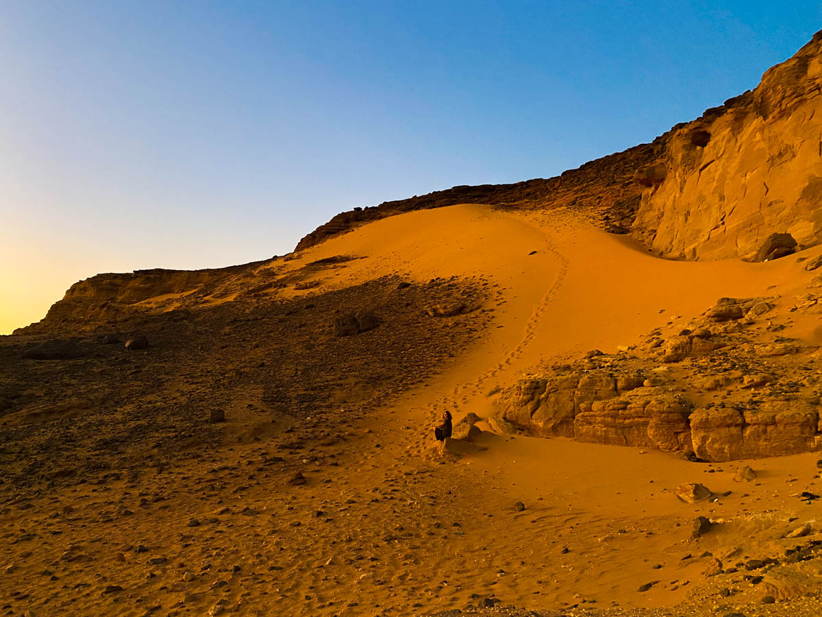 A red sand drift running down the side of Jabel Barkal