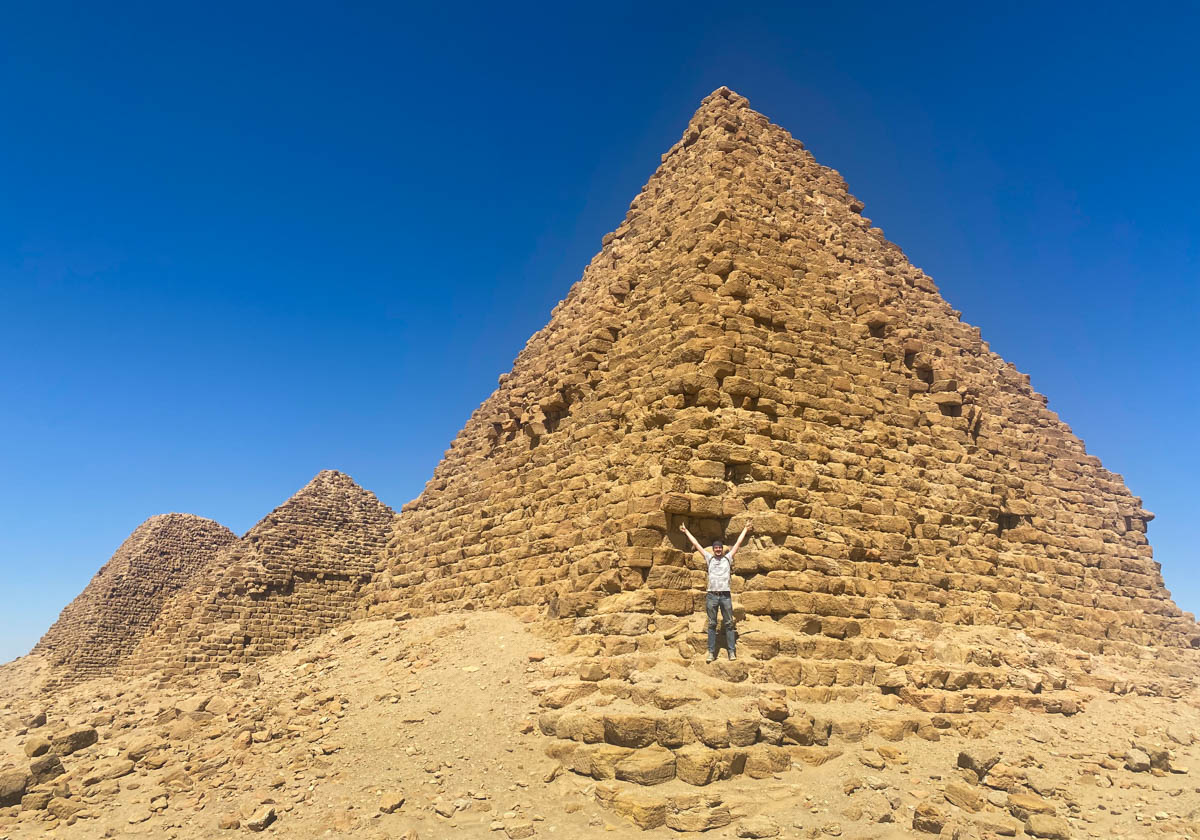 Anna standing in front of a large pyramid.