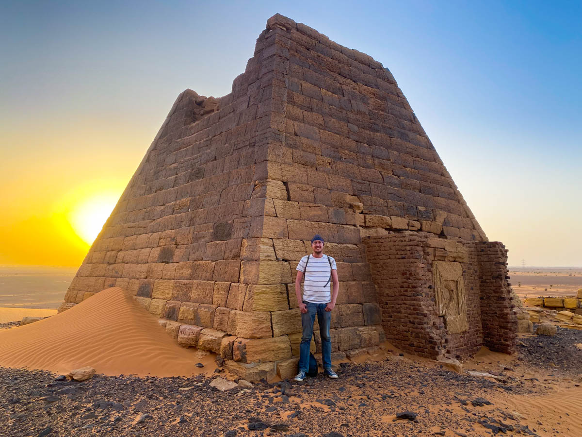 Me standing in front of one of the pyramids of Meroe with the sunsetting in the background.