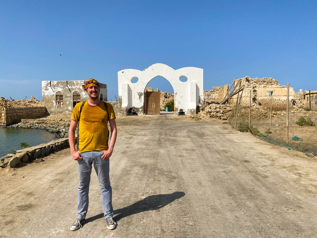 Me standing in front of the bridge to Suakin Island with the entrance gateway in the background.